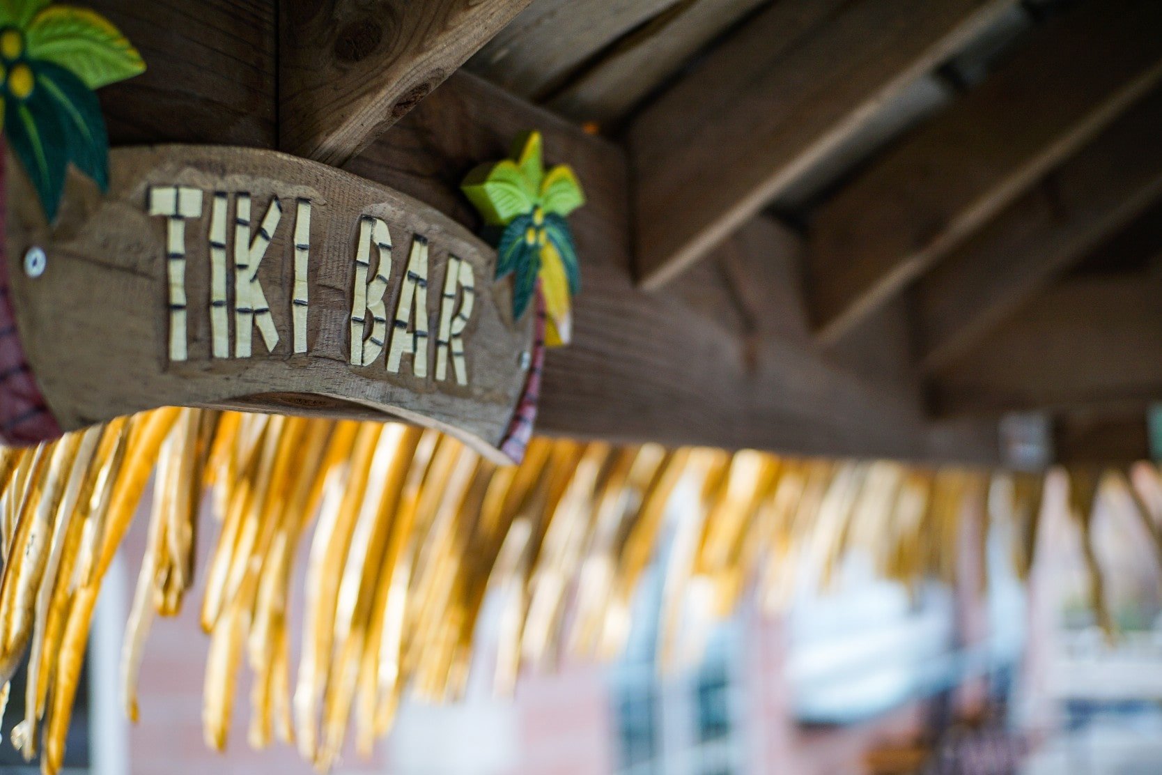 Tiki bar sign under thatched roof in Venice, Florida